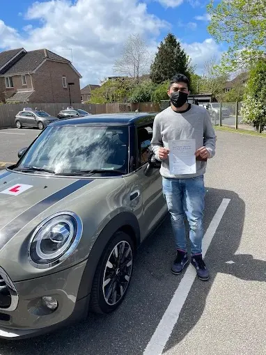 A Go Green Driving School student celebrating passing their driving test in West London