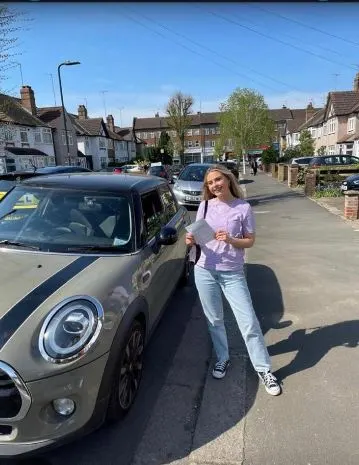 A Go Green Driving School learner celebrating their driving test pass