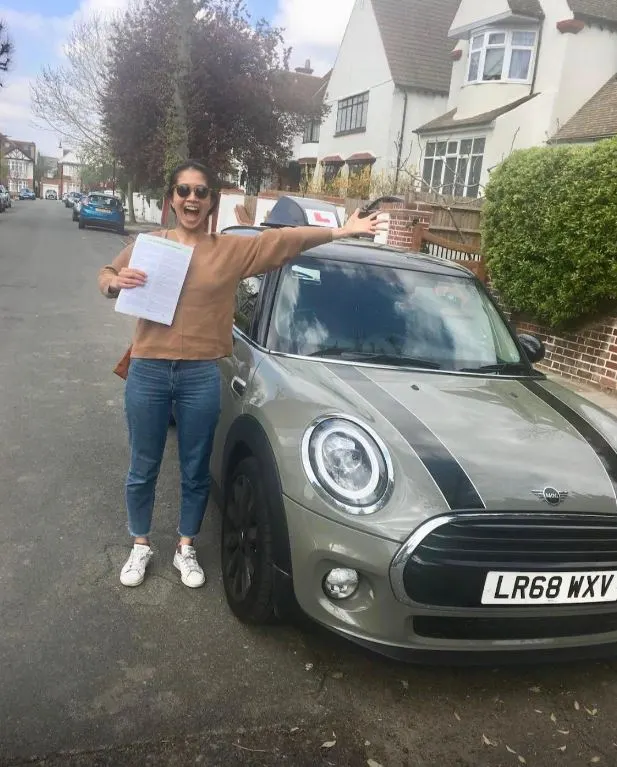 A Go Green Driving School learner celebrating their driving test pass